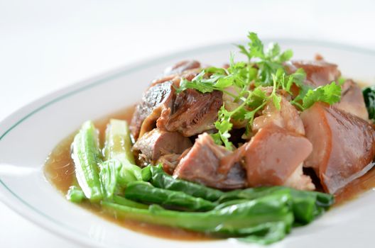  stewed pork knuckle with kale inside on white background