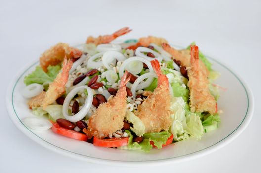fried shrimp and fresh salad on white background