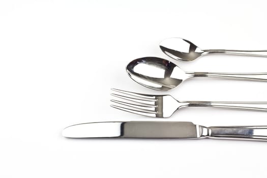 Items of cutlery on a white background