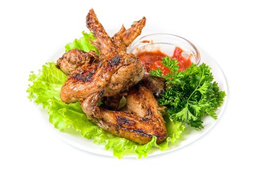 fried chicken wings with vegetables and sauce
