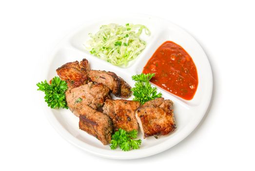 Grilled meat with sauce and vegetables isolated on white background