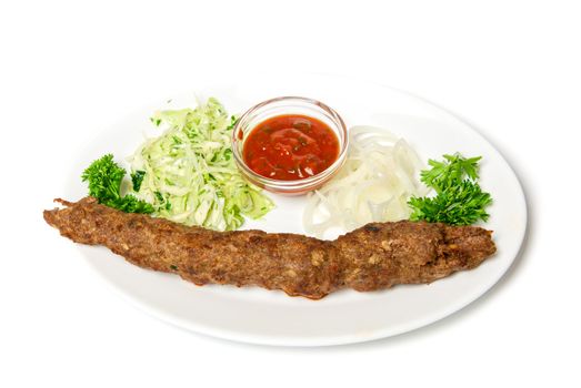 minced mutton chop with sauce and vegetables at dish