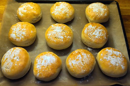 Freshly baked hamburger breads on a plate