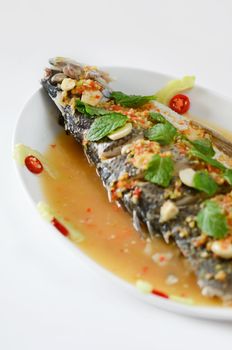 Steamed snapper fish with chili and lemon , spicy cuisine