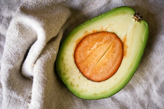 Avocado halve on a canvas background. Shallow DOF