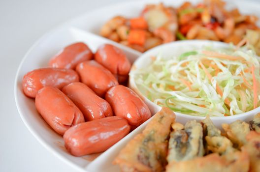 close-up of pork sausage with sweet sauce