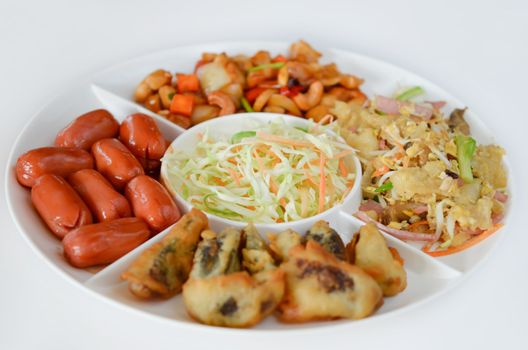  fried pork sausage , fried preserved  eggs, fried fish maw , asian style cuisine