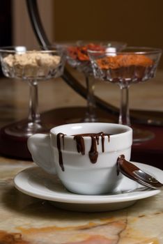 Cookies and coffe cup with chocolate flowing