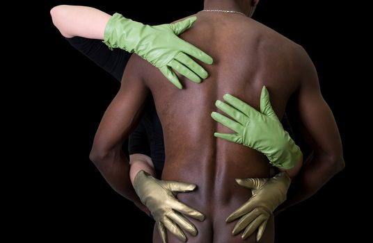 Two girl embrace black man at gloves on black