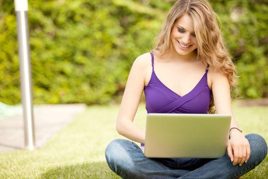 young beautiful woman using laptop computer