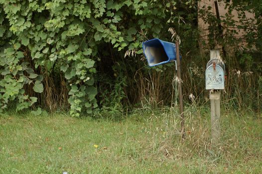 Old mailboxes sit by the side of the road in rural Washtenaw County, Michigan.