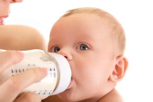 Mother give drink her baby boy by feeding bottle