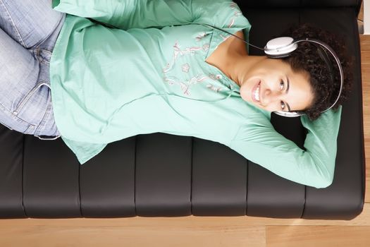 A jung brazilian woman relaxing on the sofa.