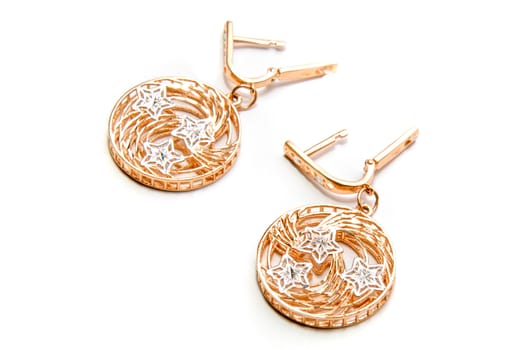 Luxury gold earring isolated on a white background