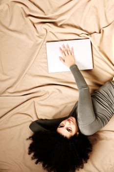 A young adult woman with a Laptop.