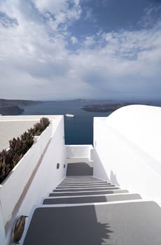 Caldera view in Santorini island with Stairway to the buildings on the cliff