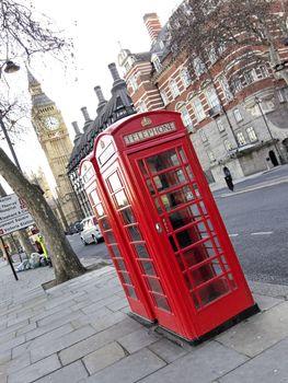 Two telephone boxes, the Clock Tower in the background, London, England, UK