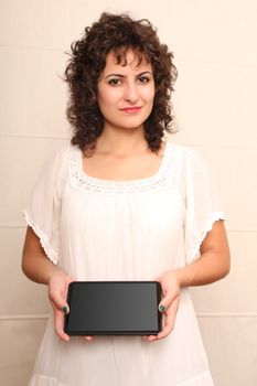 A young woman holding a Tablet PC.