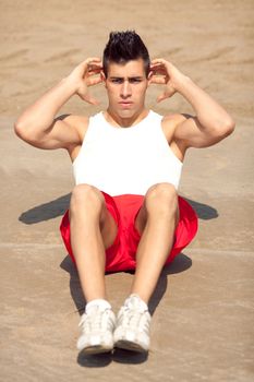 young handsome man making abs workout