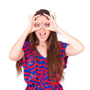 young beautiful women making googles gestures on face on white background