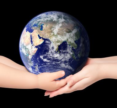 Child and woman holds earth globe on black