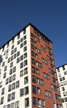 Orange Building Exterior towards Blue sky