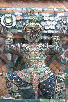 ancient demon figure in Wat Arun around pagoda, Bangkok Thailand