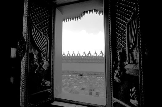 Arts on windows of Phramahathat Khannakhon tower, Khonkaen Province in Northeastern of Thailand