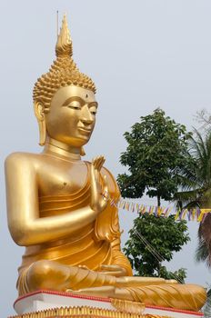 a big goldern Buddhist figure in Wat Thai