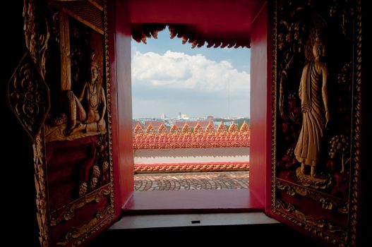Arts on windows of Phramahathat Khannakhon tower, Khonkaen Province in Northeastern of Thailand