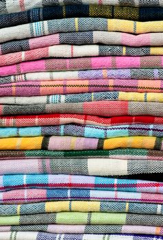 colorful of Thai Northeastern fabric, colorful and heap of Thai style native clothing 