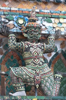 ancient demon figure in Wat Arun around pagoda, Bangkok Thailand