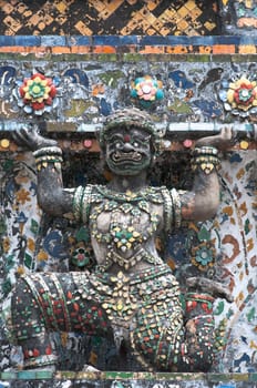 ancient demon figure in Wat Arun around pagoda, Bangkok Thailand