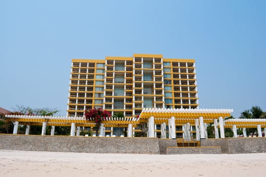yellow building next to Hua Hin beach in Thailand