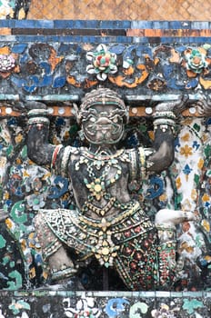 ancient demon figure in Wat Arun around pagoda, Bangkok Thailand