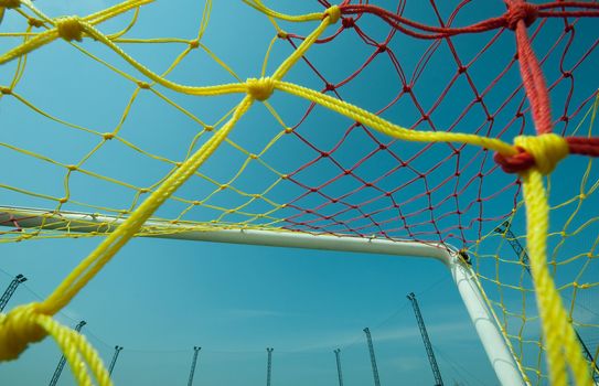 football or soccer goal under the blue sky