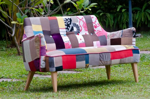 colorful sofa in a green garden