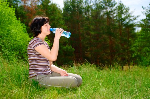 Smiling girl with a water bottle