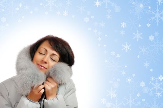 Closeup portrait of young woman in fluffy hood