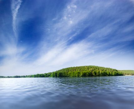 Lake shore under blue sky