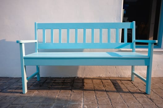 light blue street chair in the park
