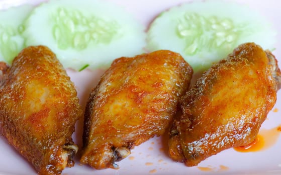 fried chicken wings with red spicy sauce 
