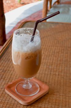 a glass of ice coffee on the table