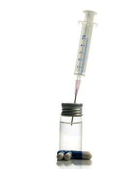 medical needle in bottle with liquid isolated on white