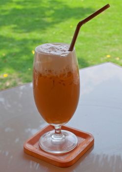 a glass of ice coffee on the table