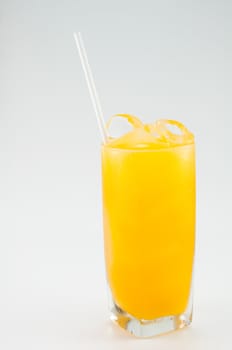 a glass of orange juice on white background