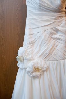 part of a wedding dress with artificial flowers