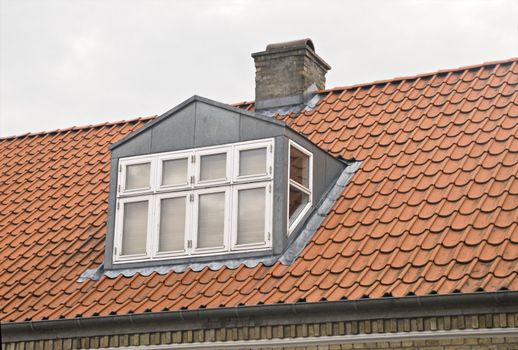 Roof with red tiling and dormer