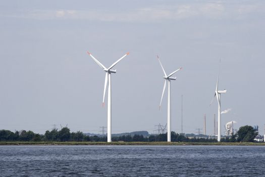 Wind generators on a river coast, Denmark