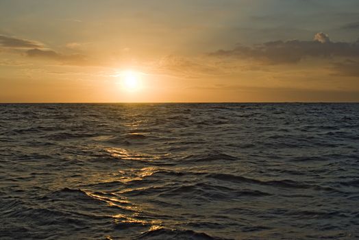 Landscape: the Sun rising over an open sea